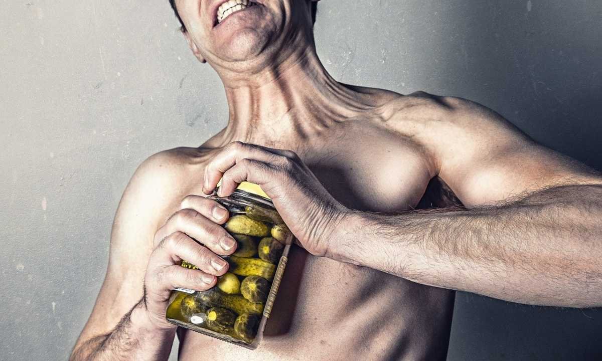 Weak man opening pickle jar